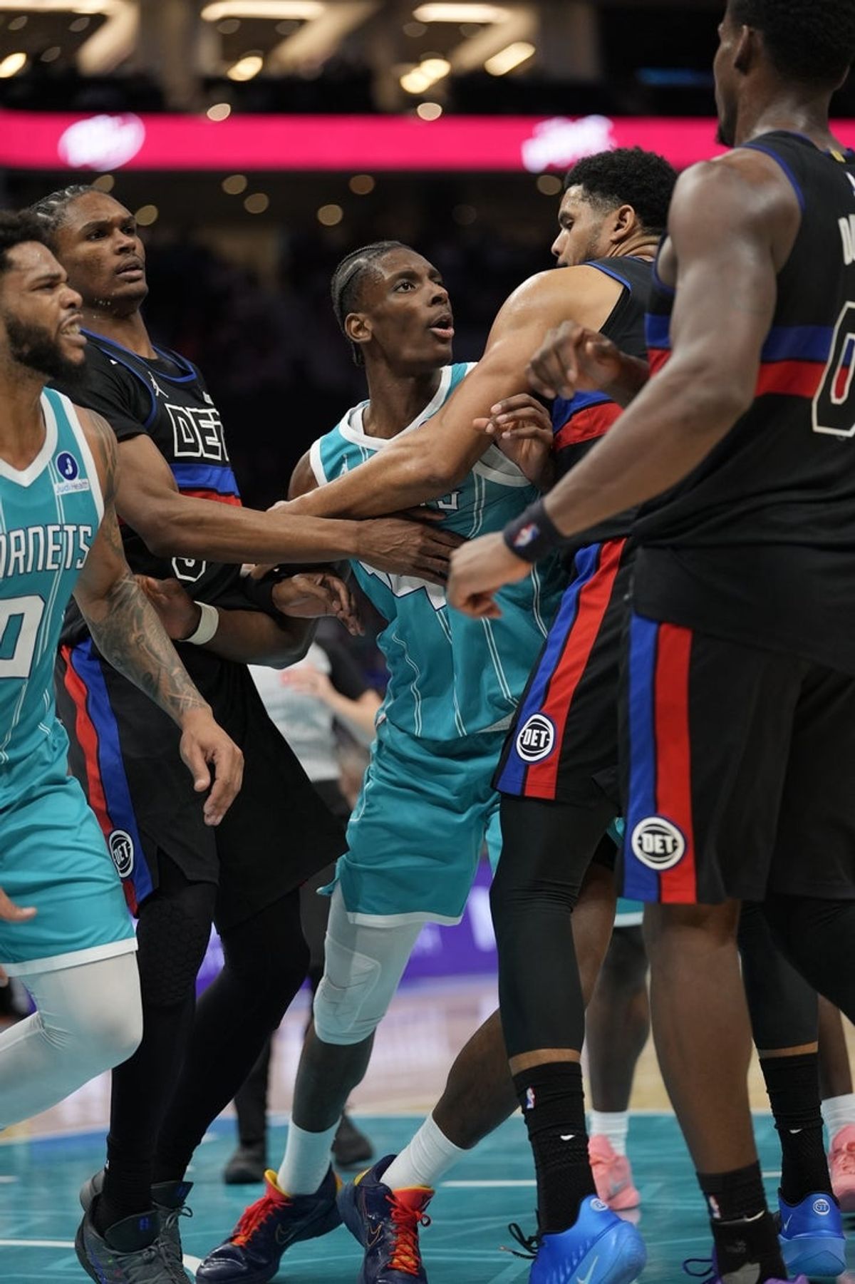 Feb 9, 2026; Charlotte, North Carolina, USA; Charlotte Hornets forward Moussa Diabaté (14) and forward Miles Bridges (0) are ejected after a fight with Detroit Pistons center Jalen Duren (0) and forward/center Isaiah Stewart (28) during the second half at Spectrum Center. Mandatory Credit: Jim Dedmon-Imagn Images