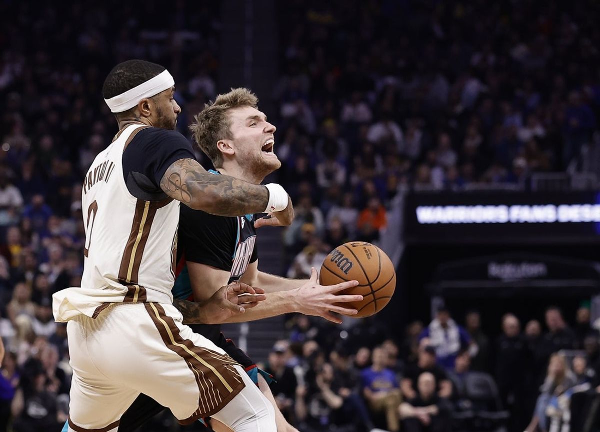Feb 9, 2026; San Francisco, California, USA; Golden State Warriors guard Gary Payton II (0) fouls Memphis Grizzlies guard Cam Spencer (24) during the second quarter at Chase Center. Mandatory Credit: Kelley L Cox-Imagn Images