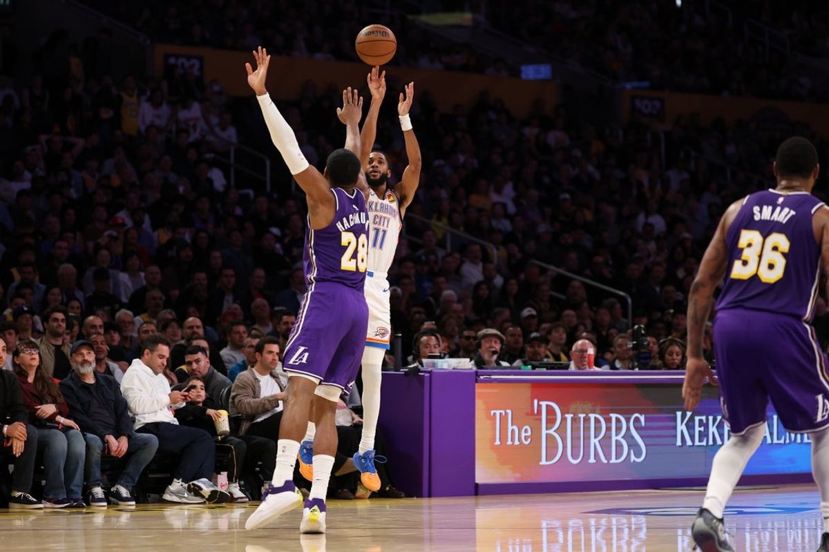 Feb 9, 2026; Los Angeles, California, USA;  Oklahoma City Thunder guard Isaiah Joe (11) shoots the ball over Los Angeles Lakers forward Rui Hachimura (28) during the second quarter at Crypto.com Arena. Mandatory Credit: Kiyoshi Mio-Imagn Images