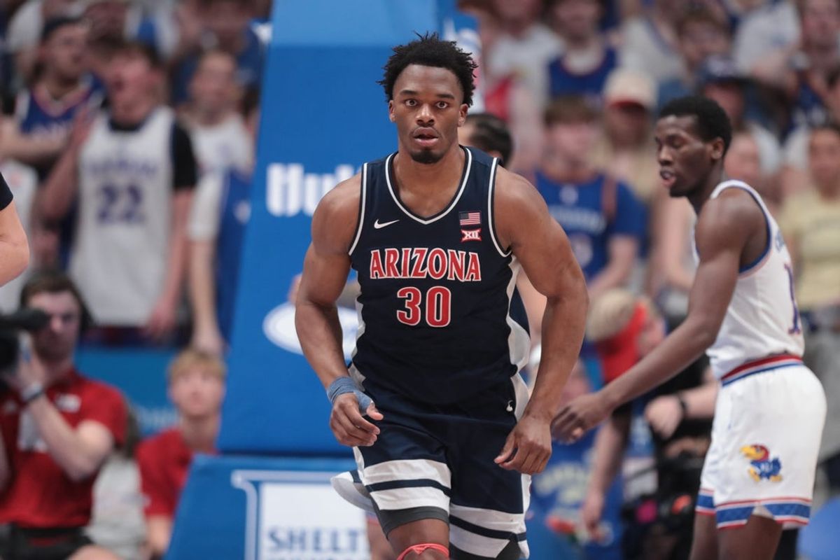 Arizona Wildcats forward Tobe Awaka (30) reacts after scoring against Kansas Jayhawks during the game inside Allen Fieldhouse on Feb. 9, 2026.