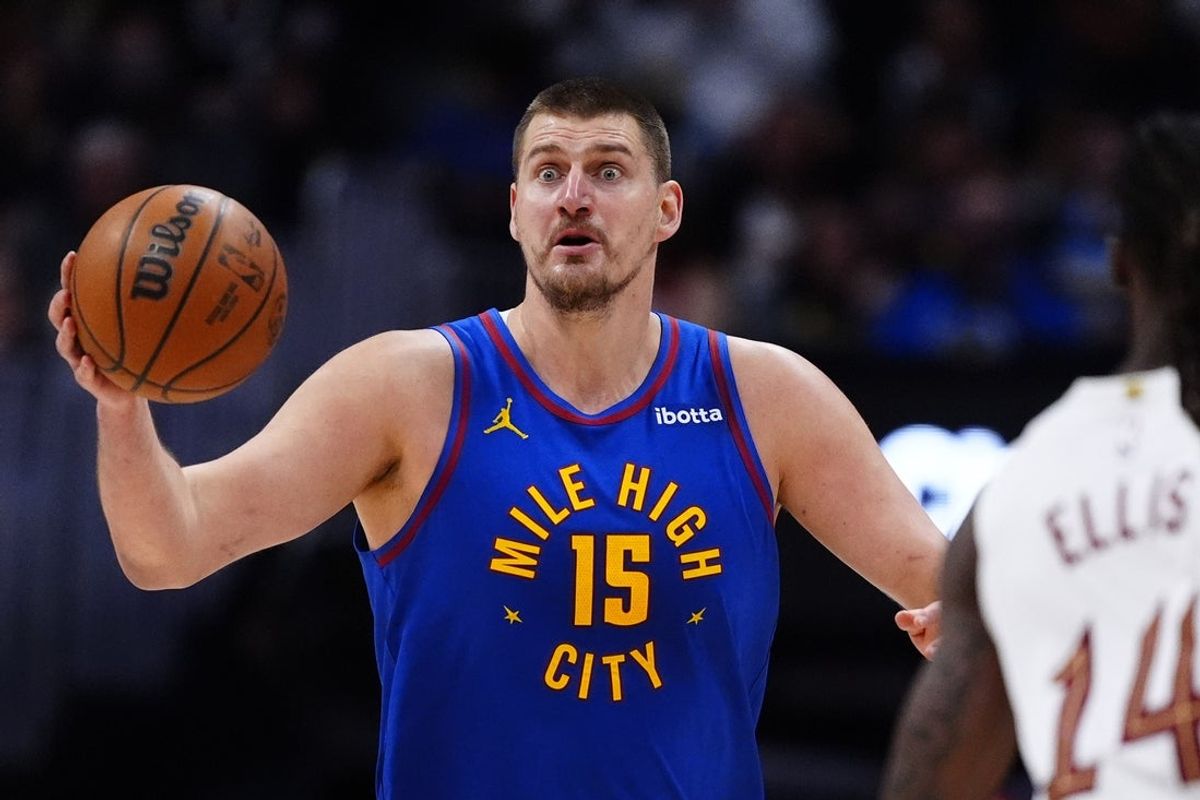Feb 9, 2026; Denver, Colorado, USA; Denver Nuggets center Nikola Jokic (15) reacts in the second quarter against the Cleveland Cavaliers at Ball Arena. Mandatory Credit: Ron Chenoy-Imagn Images