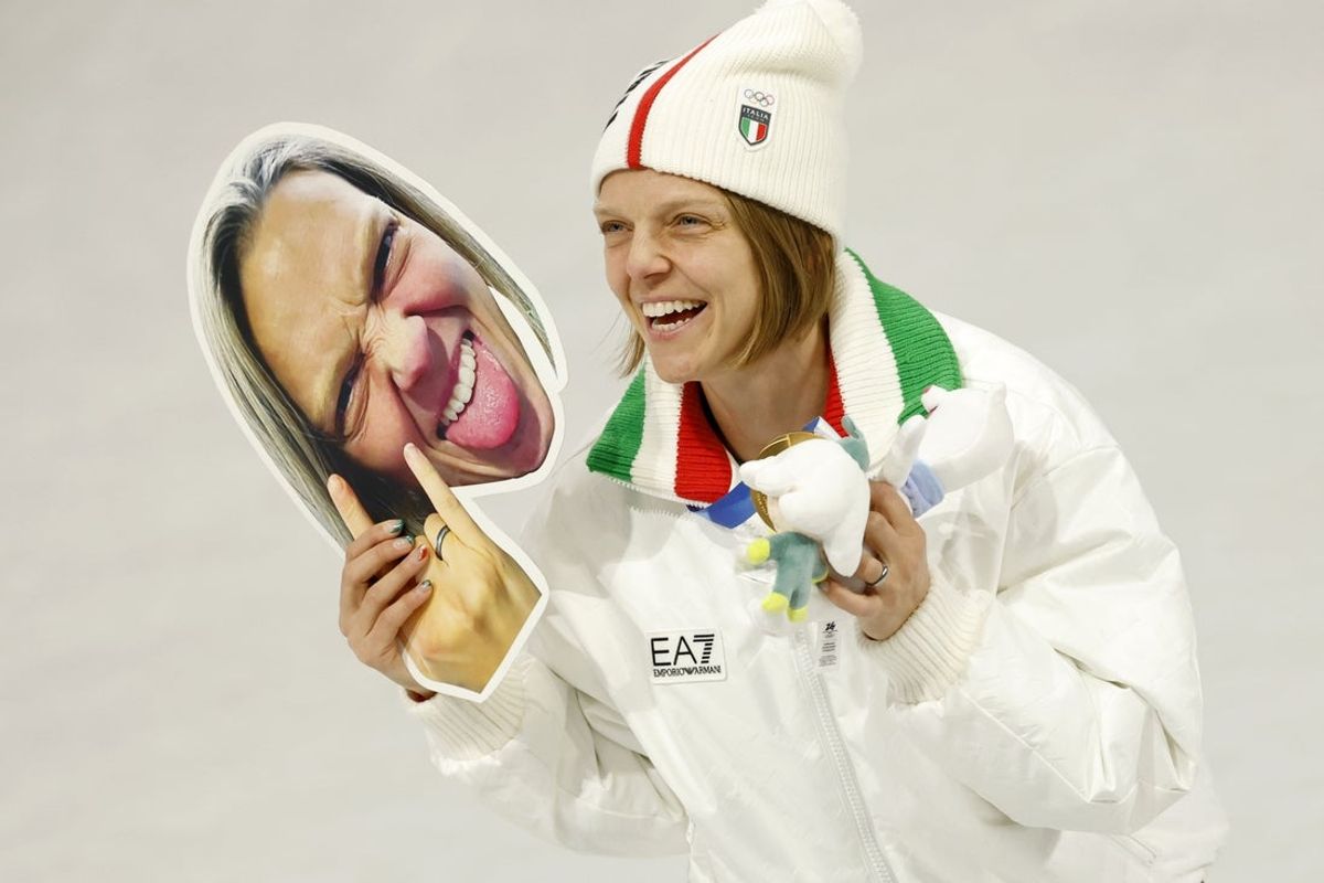 Feb 10, 2026; Milan, Italy; Arianna Fontana of Italy celebrates after winning gold in the mixed team relay during the Milano Cortina 2026 Olympic Winter Games at Milano Ice Skating Arena. Mandatory Credit: Geoff Burke-Imagn Images
