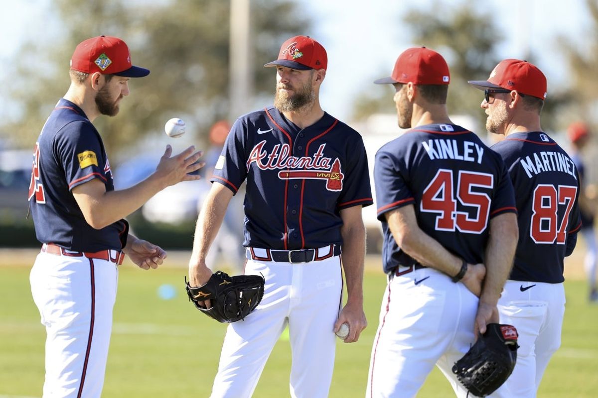 Feb 10, 2026; North Port, FL, USA; Atlanta Braves pitcher Chris Sale (51) talks with pitcher Dylan Lee (52), pitcher Tyler Kinley (45) and coach J.P. Martinez (87) works out during spring training workouts. Mandatory Credit: Kim Klement Neitzel-Imagn Images