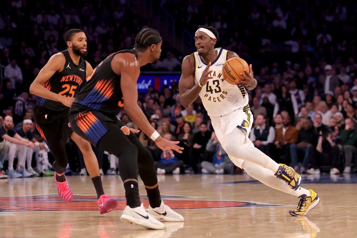 Feb 10, 2026; New York, New York, USA; Indiana Pacers forward Pascal Siakam (43) controls the ball against New York Knicks guard Mikal Bridges (25) and center Ariel Hukporti (55) during the first quarter at Madison Square Garden. Mandatory Credit: Brad Penner-Imagn Images