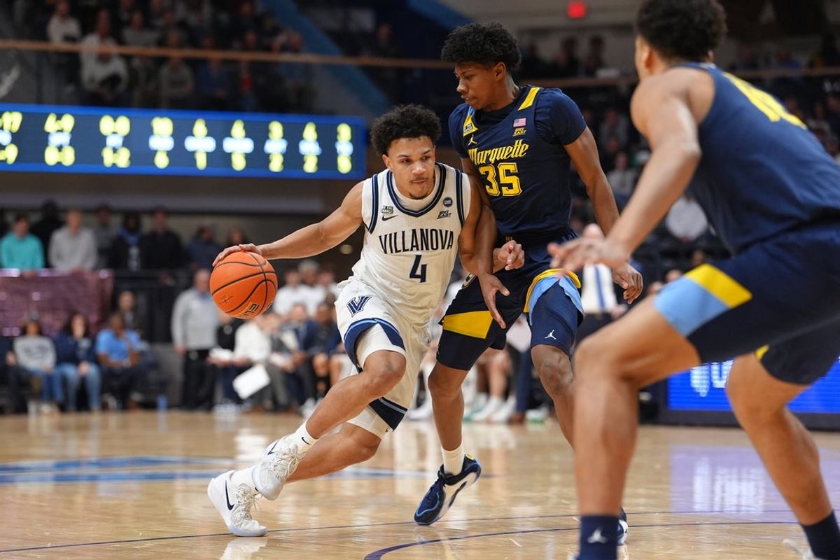Feb 10, 2026; Villanova, Pennsylvania, USA; Villanova Wildcats guard Tyler Perkins (4) drives against Marquette Golden Eagles forward Michael Phillips II (35) in the first half at William B. Finneran Pavilion. Mandatory Credit: Kyle Ross-Imagn Images