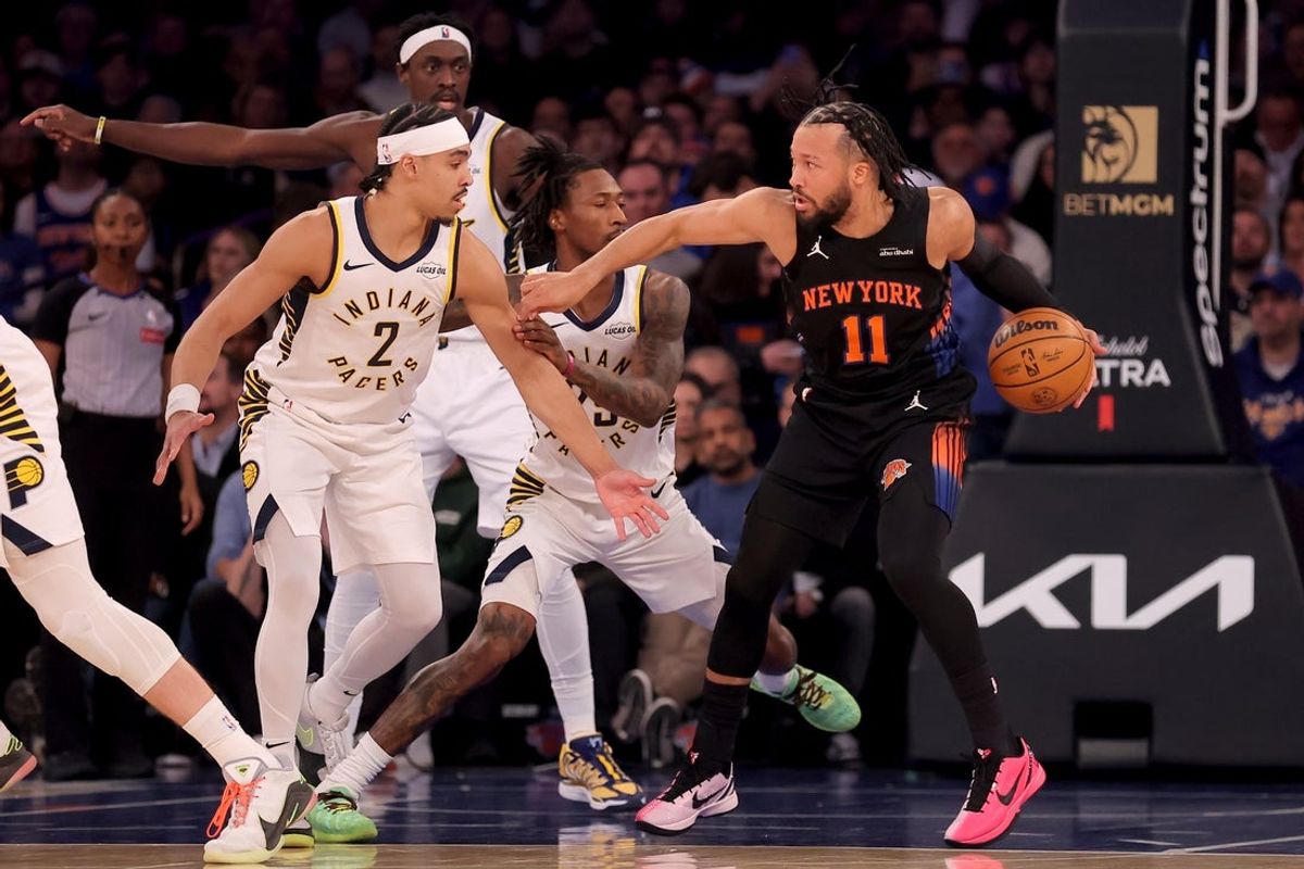 Feb 10, 2026; New York, New York, USA; New York Knicks guard Jalen Brunson (11) controls the ball against Indiana Pacers guards Andrew Nembhard (2) and Quenton Jackson (29) during the first quarter at Madison Square Garden. Mandatory Credit: Brad Penner-Imagn Images
