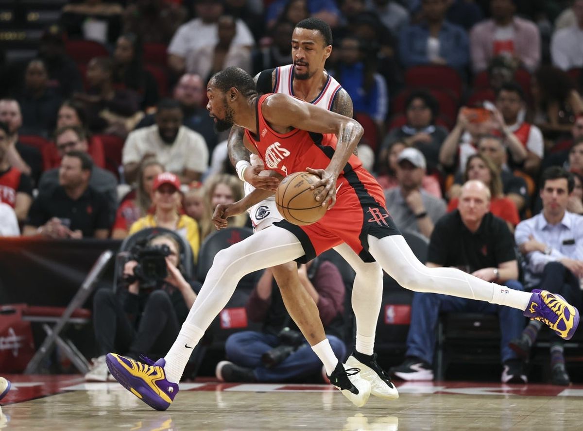 Feb 10, 2026; Houston, Texas, USA; Houston Rockets forward Kevin Durant (7) drives with the ball as Los Angeles Clippers forward John Collins (20) defends during the second quarter at Toyota Center. Mandatory Credit: Troy Taormina-Imagn Images