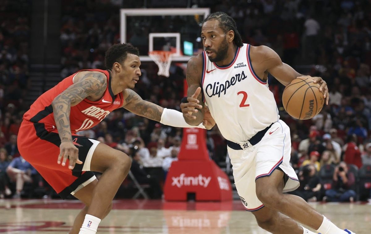 Feb 10, 2026; Houston, Texas, USA; Los Angeles Clippers forward Kawhi Leonard (2) drives with the ball as Houston Rockets forward Jabari Smith Jr. (10) defends during the second quarter at Toyota Center. Mandatory Credit: Troy Taormina-Imagn Images