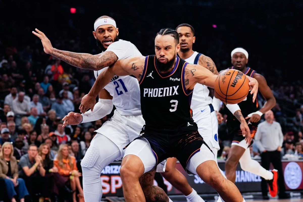 Feb 10, 2026; Phoenix, Arizona, USA;  Phoenix Suns guard/forward Dillon Brooks (3) goes against Dallas Mavericks forward/center Daniel Gafford (21) in the first half of the game at Mortgage Matchup Center. Mandatory Credit: Arianna Grainey-Imagn Images