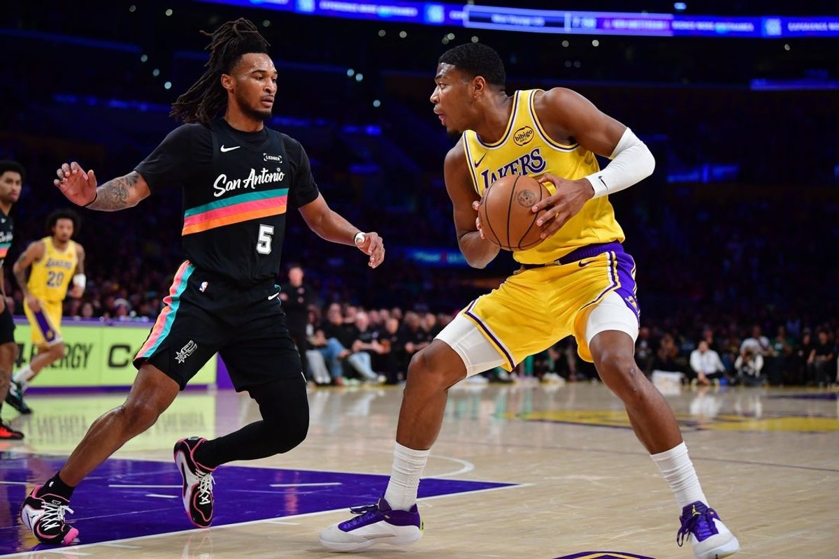 Feb 10, 2026; Los Angeles, California, USA; Los Angeles Lakers forward Rui Hachimura (28) controls the ball against San Antonio Spurs guard Stephon Castle (5) during the first half at Crypto.com Arena. Mandatory Credit: Gary A. Vasquez-Imagn Images