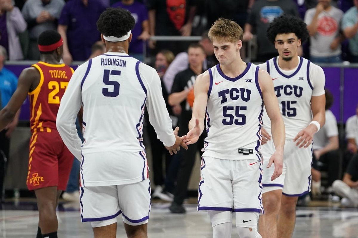 Feb 10, 2026; Fort Worth, Texas, USA;  TCU Horned Frogs guard Tanner Toolson (55) and forward Micah Robinson (5) react after the game against the Iowa State Cyclones at Ed and Rae Schollmaier Arena. Mandatory Credit: Raymond Carlin III-Imagn Images