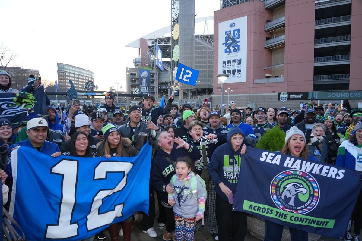 Feb 11, 2026; Seattle, WA, USA; Seattle Seahawks fans at Lumen Field react during the Super Bowl LX parade. Mandatory Credit: Kirby Lee-Imagn Images