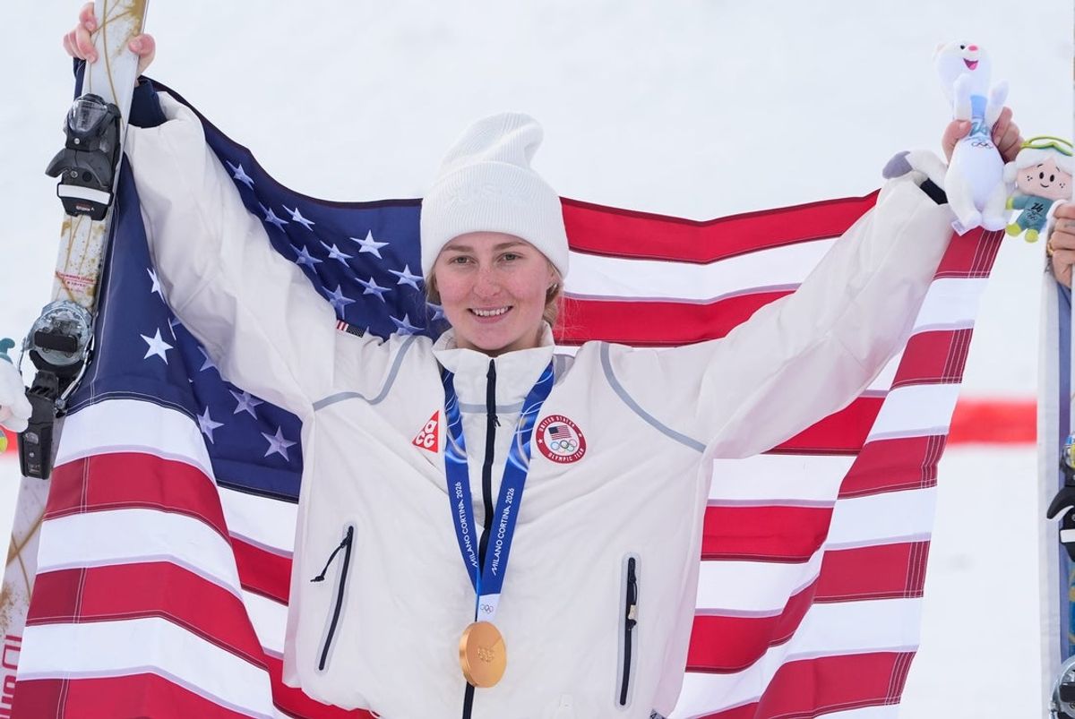 Feb 11, 2026; Livigno, Italy; Gold medalist Elizabeth Lemley of the United States celebrates during the freestyle skiing women's moguls final during the Milano Cortina 2026 Olympic Winter Games at Livigno Aerials & Moguls Park. Mandatory Credit: Jack Gruber-USA TODAY