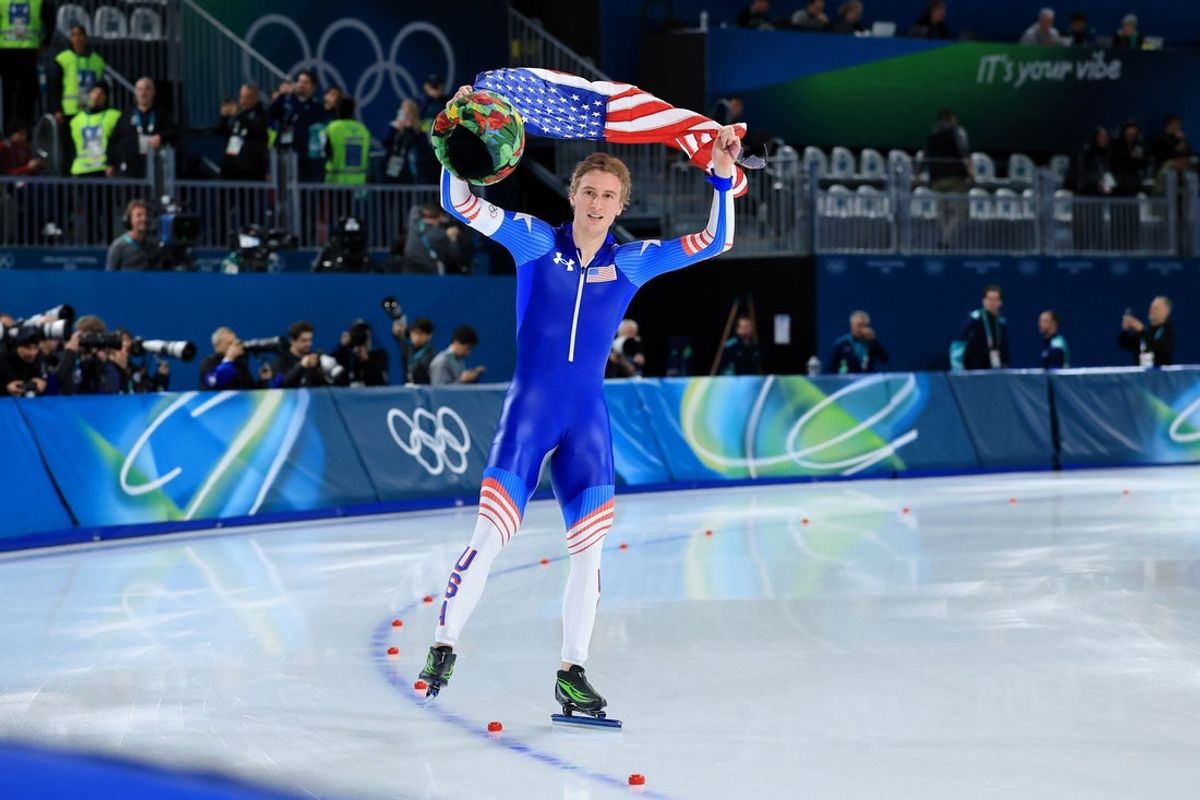 Feb 11, 2026; Milan, Italy; Jordan Stolz of the United States celebrates winning gold in men's speed skating 1000m during the Milano Cortina 2026 Olympic Winter Games at Milano Speed Skating Stadium. Mandatory Credit: Katie Stratman-Imagn Images