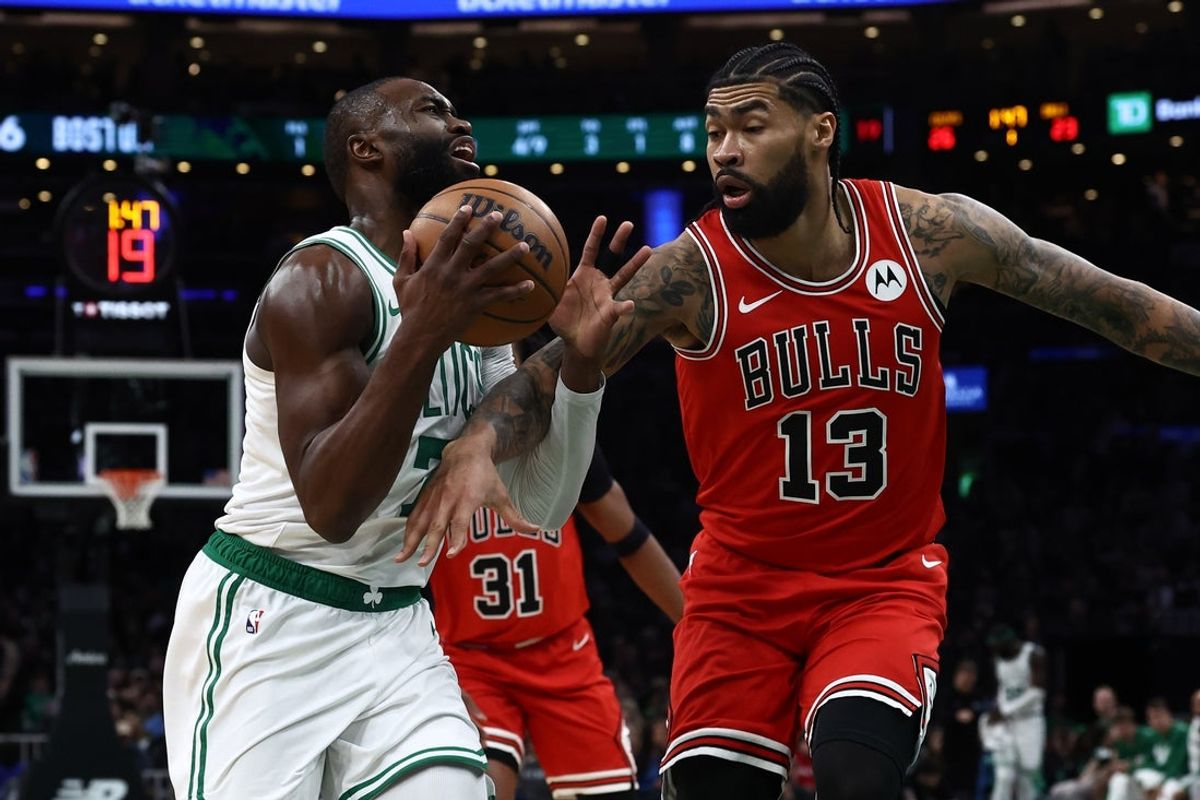 Feb 11, 2026; Boston, Massachusetts, USA; Chicago Bulls center Nick Richards (13) fouls Boston Celtics guard Jaylen Brown (7) during the first quarter at TD Garden. Mandatory Credit: Winslow Townson-Imagn Images