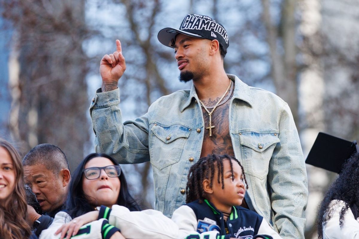 Feb 11, 2026; Seattle, WA, USA;  Seattle Seahawks wide receiver Jaxon Smith-Njigba (11) reacts during the Super Bowl LX parade. Mandatory Credit: Kevin Ng-Imagn Images