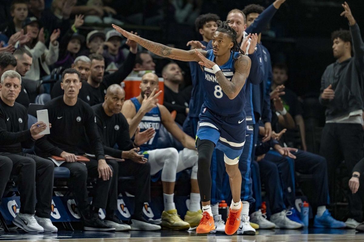 Feb 11, 2026; Minneapolis, Minnesota, USA; Minnesota Timberwolves guard Bones Hyland (8) celebrates making a three-point shot against the Portland Trail Blazers in the first half at Target Center. Mandatory Credit: Jesse Johnson-Imagn Images