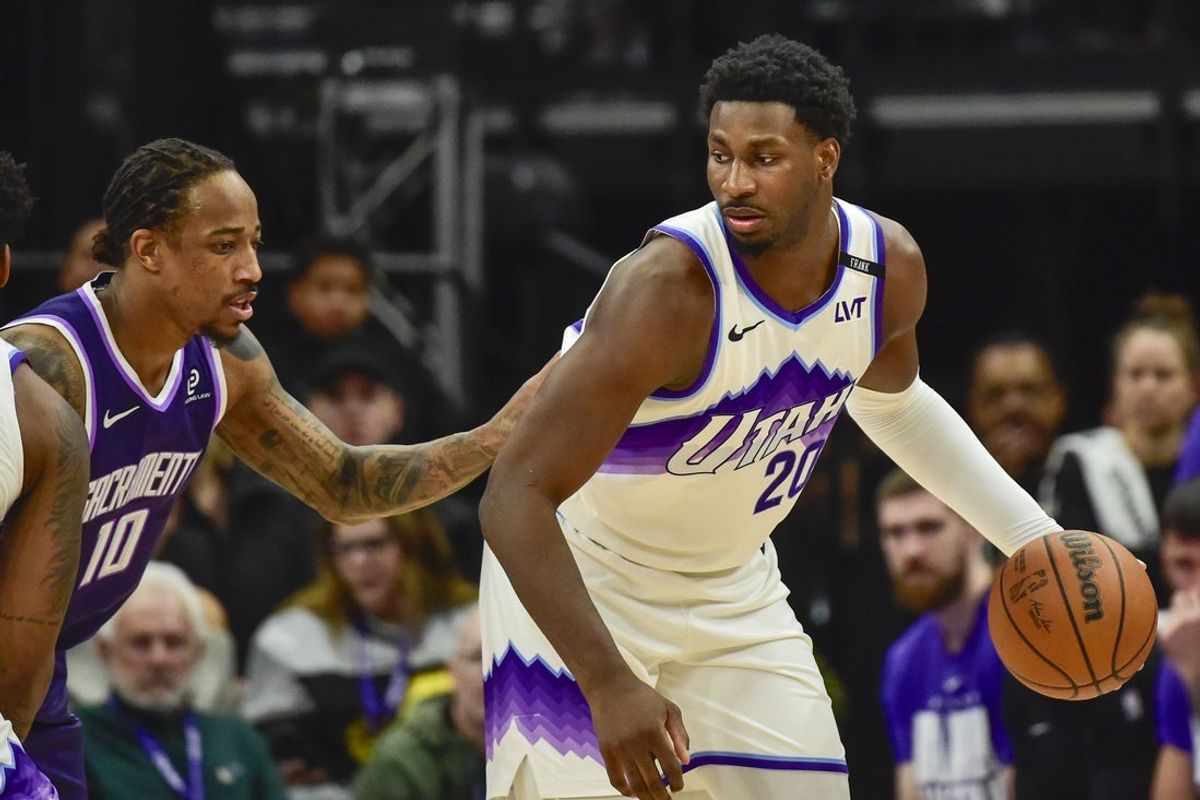 Feb 11, 2026; Salt Lake City, Utah, USA; Utah Jazz forward Jaren Jackson Jr. (20) plans his next move around Sacramento Kings guard/forward DeMar DeRozan (10) during the first half at Delta Center. Mandatory Credit: Peter Creveling-Imagn Images