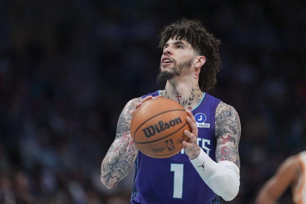 Feb 11, 2026; Charlotte, North Carolina, USA; Charlotte Hornets guard LaMelo Ball (1) shoots a free throw during the second half against the Atlanta Hawks at Spectrum Center. Mandatory Credit: Jim Dedmon-Imagn Images