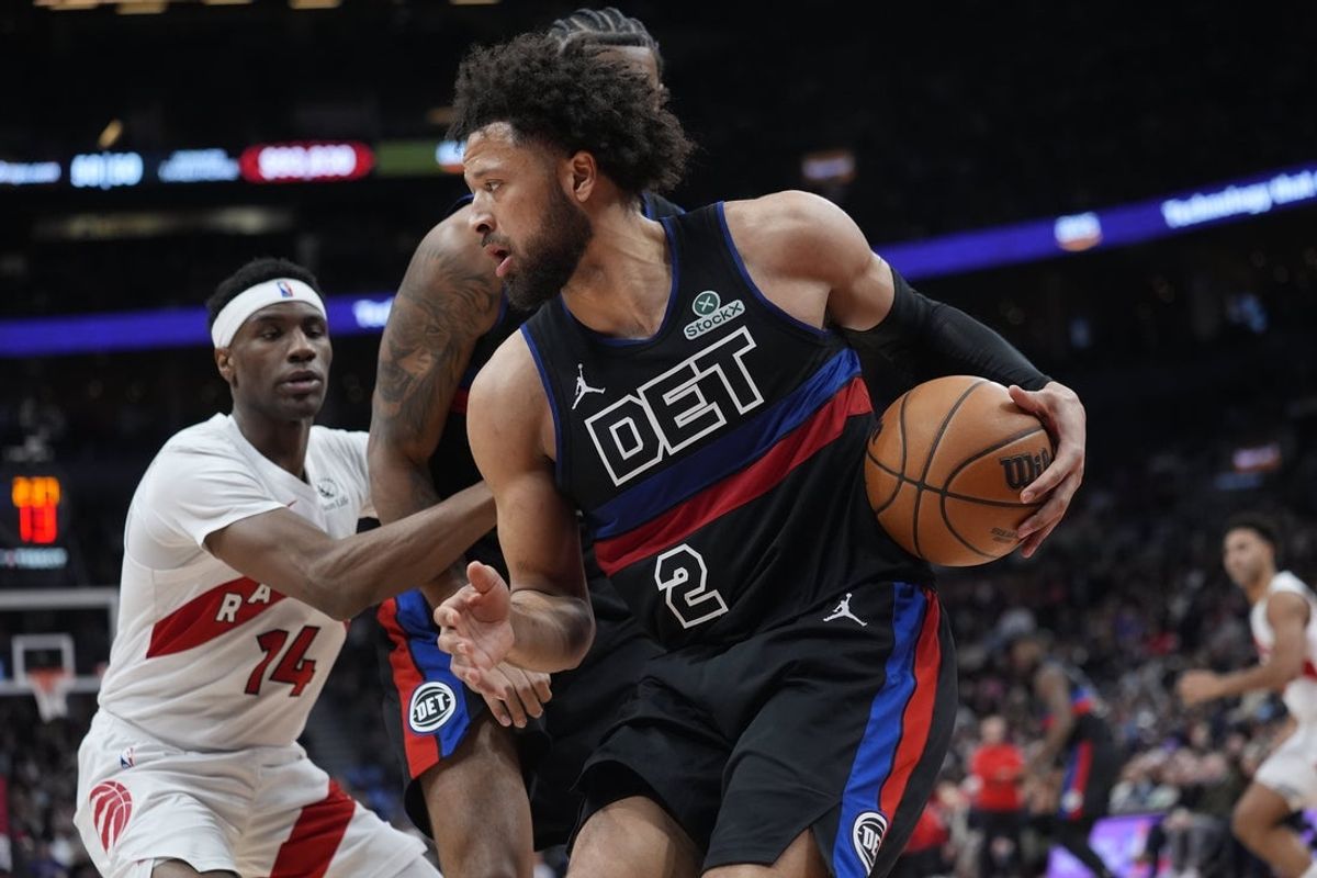 Feb 11, 2026; Toronto, Ontario, CAN; Detroit Pistons guard Cade Cunningham (2) controls the ball against Toronto Raptors guard Ja'Kobe Walter (14) during the second half at Scotiabank Arena. Mandatory Credit: John E. Sokolowski-Imagn Images