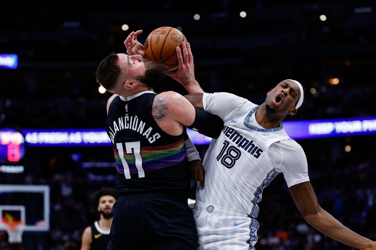 Feb 11, 2026; Denver, Colorado, USA; Denver Nuggets center Jonas Valanciunas (17) is fouled by Memphis Grizzlies forward Olivier-Maxence Prosper (18) in the second quarter at Ball Arena. Mandatory Credit: Isaiah J. Downing-Imagn Images