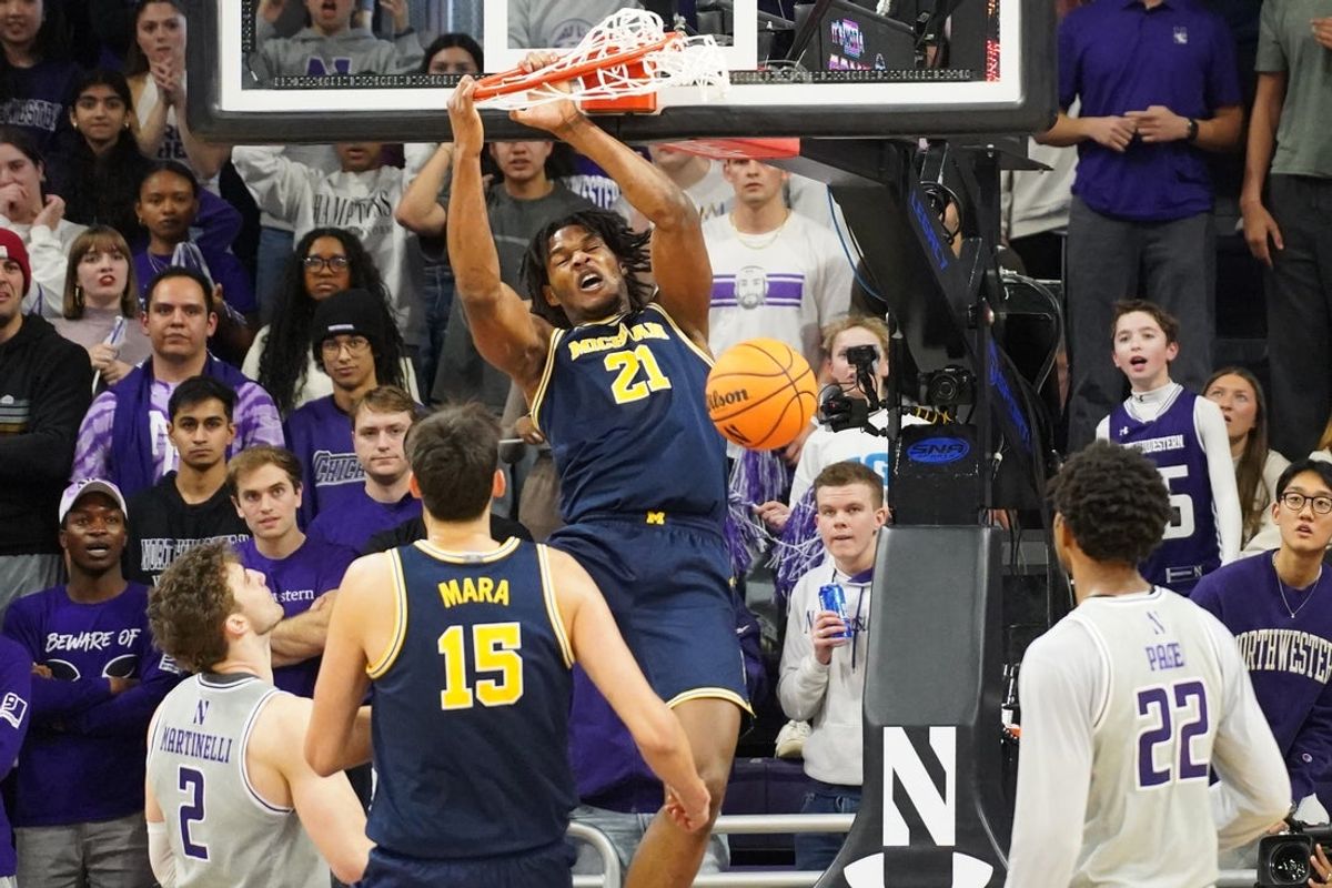 Feb 11, 2026; Evanston, Illinois, USA; Michigan Wolverines forward Morez Johnson Jr. (21) dunks the ball against the Northwestern Wildcats during the second half at Welsh-Ryan Arena. Mandatory Credit: David Banks-Imagn Images