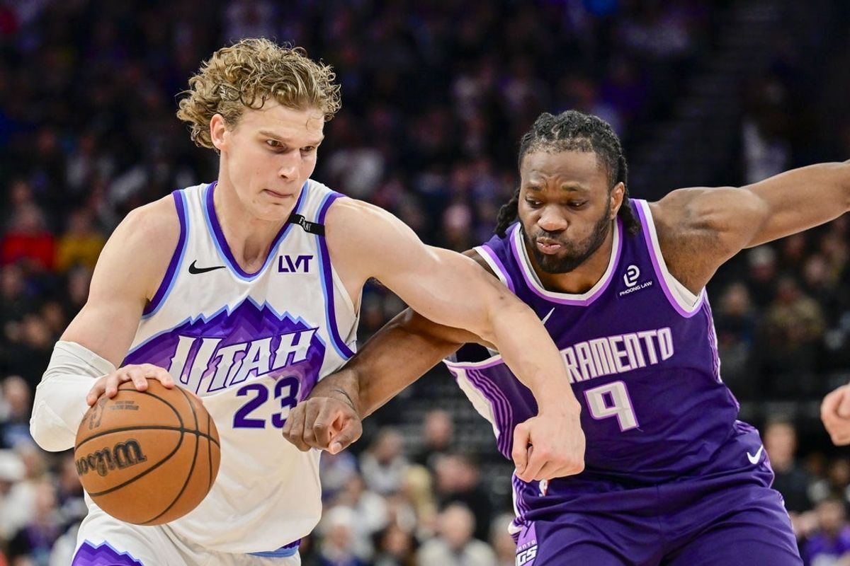 Feb 11, 2026; Salt Lake City, Utah, USA; Utah Jazz forward/center Lauri Markkanen (23) makes a quick move around Sacramento Kings forward Precious Achiuwa (9) during the second half at Delta Center. Mandatory Credit: Peter Creveling-Imagn Images