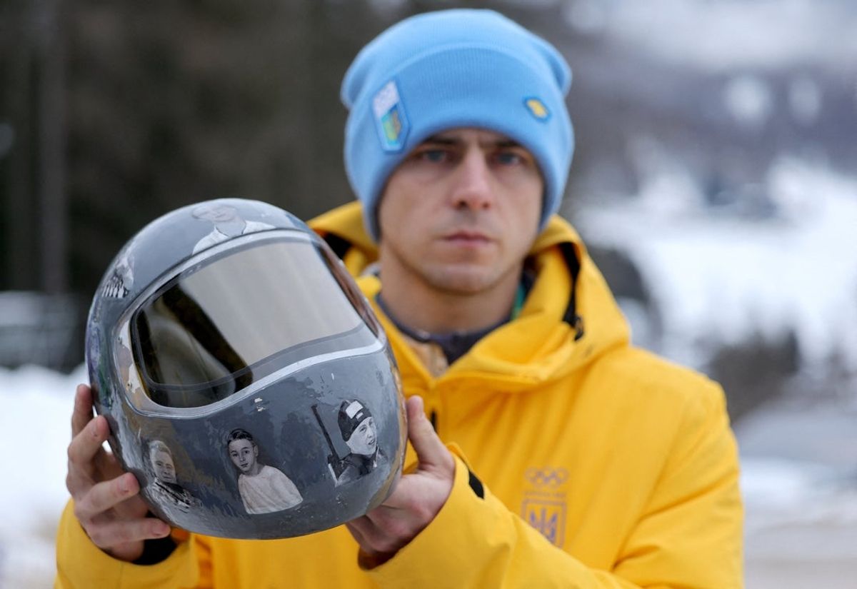 [US, Mexico & Canada customers only] Feb 12, 2026; Cortina d'Ampezzo, Italy; Vladyslav Heraskevych of Ukraine shows his helmet following his disqualification from the Milano Cortina 2026 Olympic Winter Games for wearing it in tribute to athletes who have died amid Russia's attack on Ukraine after a scheduled meeting with IOC President Kirsty Coventry at Cortina Sliding Centre. Mandatory Credit: Athit Perawongmetha-Reuters via Imagn Images