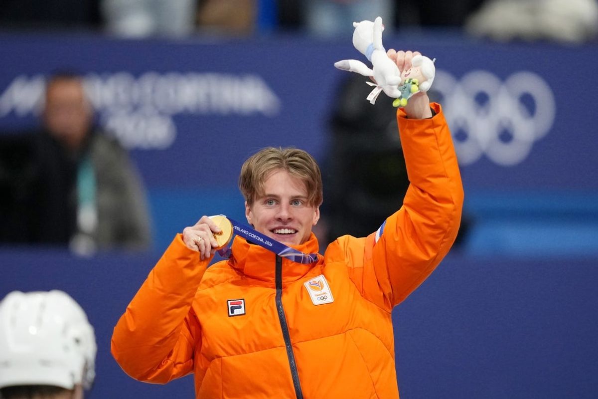 Feb 12, 2026; Milan, Italy; Gold medalist Jens van 'T Wout of the Netherlands celebrates during the medal ceremony for the men's 1000m during the Milano Cortina 2026 Olympic Winter Games at Milano Ice Skating Arena. Mandatory Credit: James Lang-Imagn Images