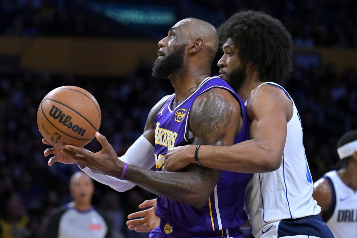 Feb 12, 2026; Los Angeles, California, USA;  Los Angeles Lakers forward LeBron James (23) is fouled by Dallas Mavericks forward Marvin Bagley III (35) in the first half at Crypto.com Arena. Mandatory Credit: Jayne Kamin-Oncea-Imagn Images