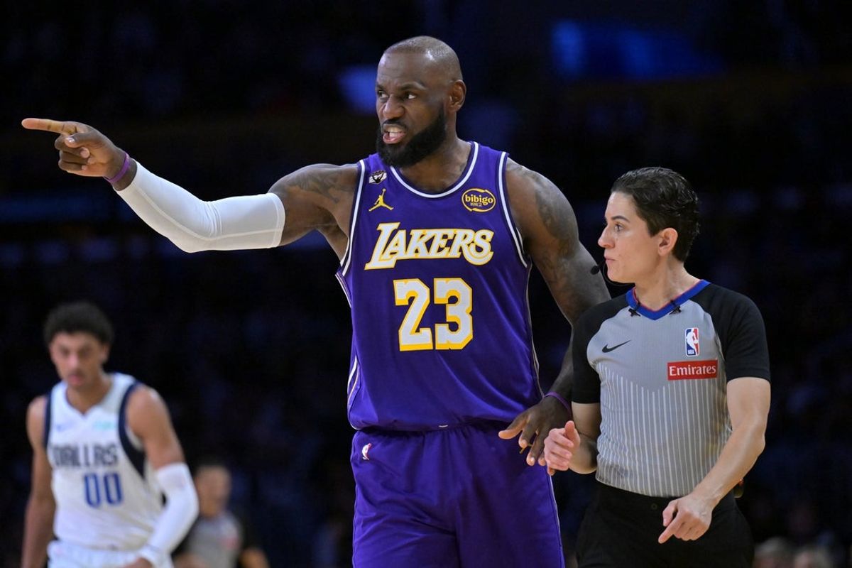 Feb 12, 2026; Los Angeles, California, USA;  Los Angeles Lakers forward LeBron James (23) pleads his case to referee Che Flores (91) in the second half against the Dallas Mavericks at Crypto.com Arena. Mandatory Credit: Jayne Kamin-Oncea-Imagn Images
