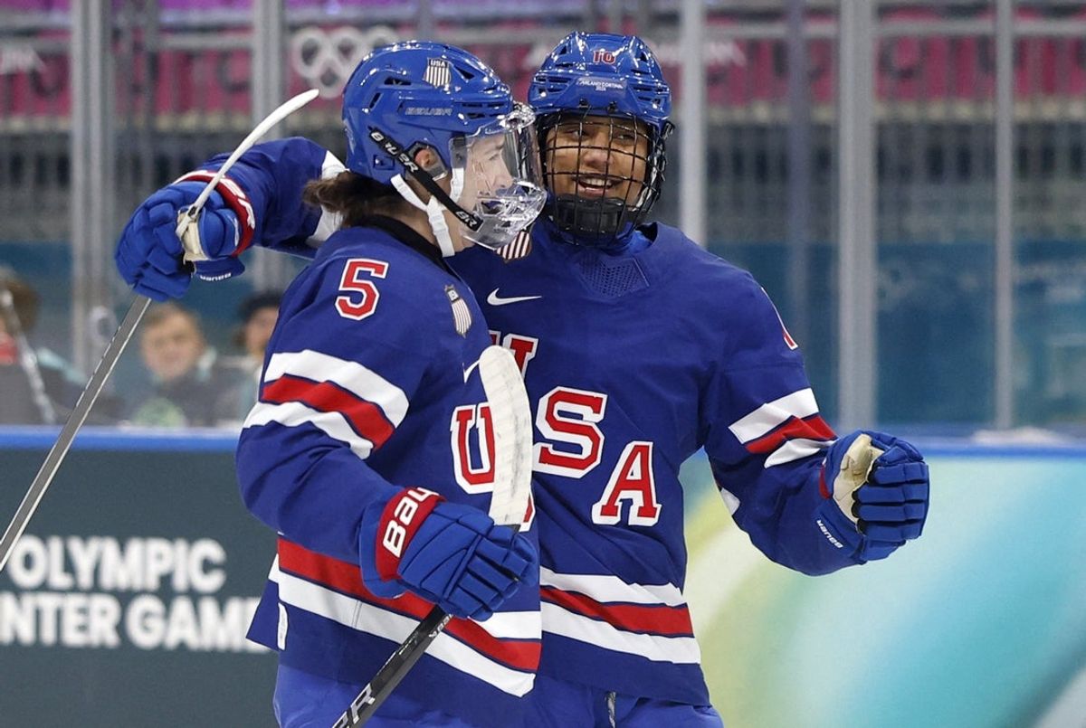 [US, Mexico & Canada customers only] Feb 13, 2026; Milan, Italy; Megan Keller of United States celebrates scoring their first goal with Laila Edwards of United States against Italy in a women's ice hockey quarterfinal during the Milano Cortina 2026 Olympic Winter Games at Milano Rho Ice Hockey Arena. Mandatory Credit: David W Cerny/Reuters via Imagn Images