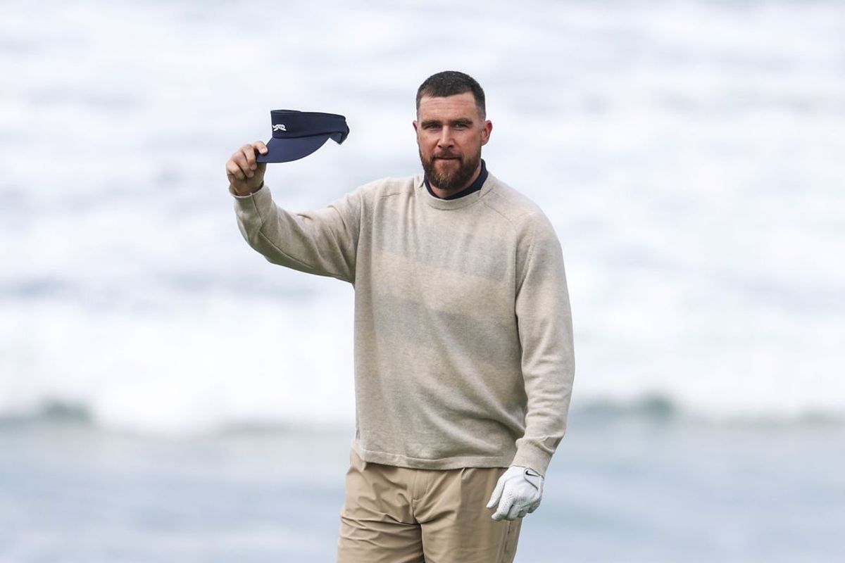 Feb 13, 2026; Pebble Beach, California, USA; Kansas City Chiefs tight end Travis Kelce acknowledges the crowd on the 10th hole during the second round of the AT&T Pebble Beach Pro-Am golf tournament at Pebble Beach Golf Links. Mandatory Credit: Kiyoshi Mio-Imagn Images