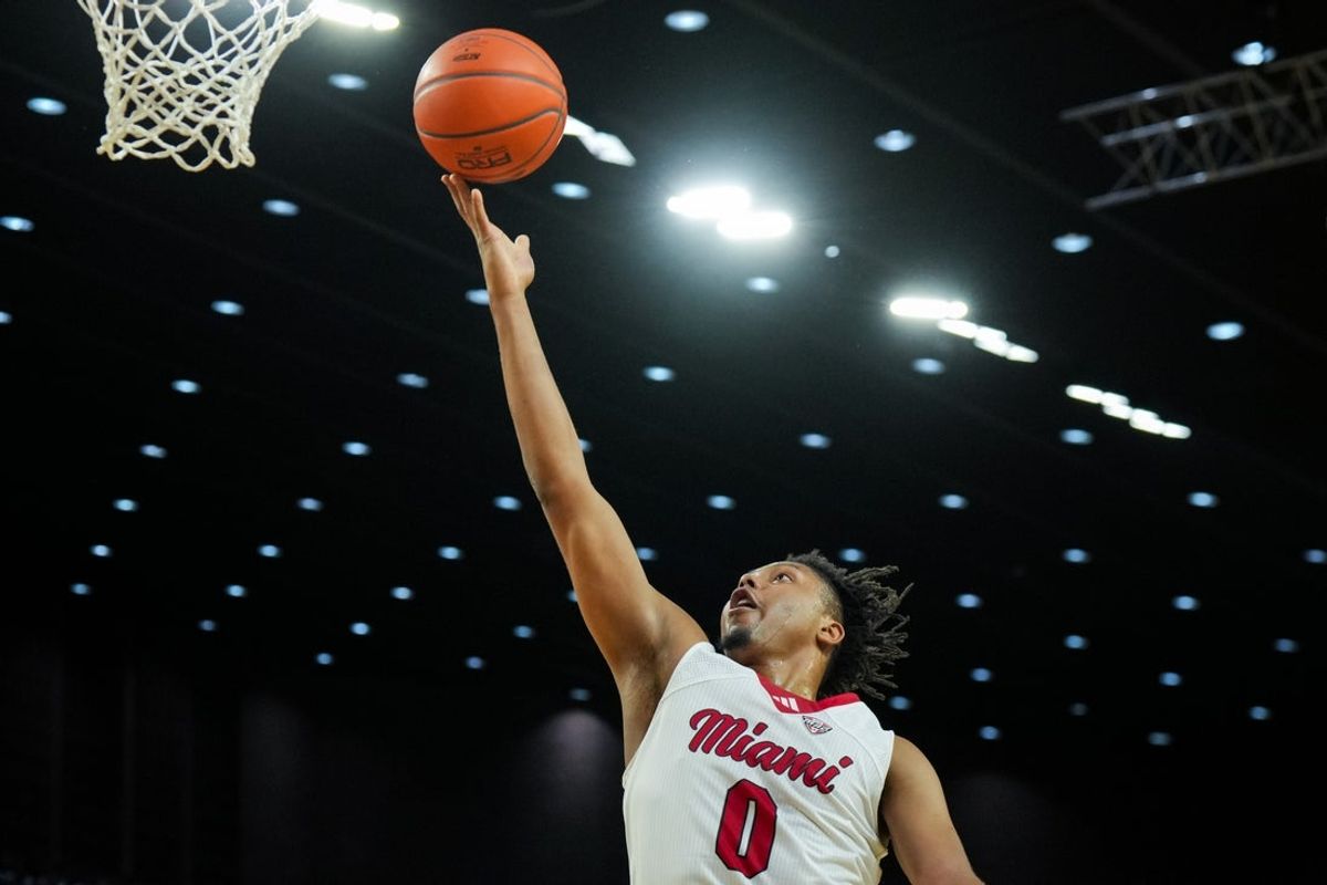 Feb 13, 2026; Miami, Ohio, USA;  Miami (OH) RedHawks forward Eian Elmer (0) drives to the basket against the Ohio Bobcats in the first half at Millett Hall. Mandatory Credit: Aaron Doster-Imagn Images