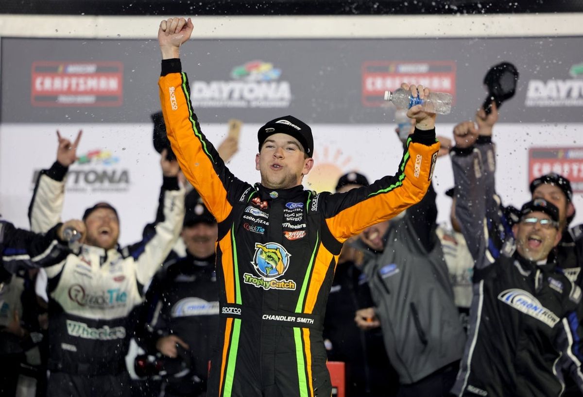 Feb 13, 2026; Daytona Beach, Florida, USA; NASCAR Truck Series driver Chandler Smith (38) celebrates after winning the Craftsman Truck series Fresh From Florida 250 at Daytona International Speedway. Mandatory Credit: Mike Dinovo-Imagn Images
