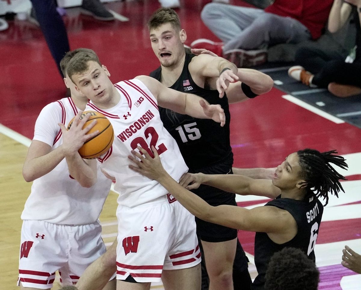 Wisconsin forward Aleksas Bieliauskas (32) out rebounds Michigan State center Carson Cooper (15) during the first half of their game Friday, February 13, 2026 at the Kohler Center in Madison.