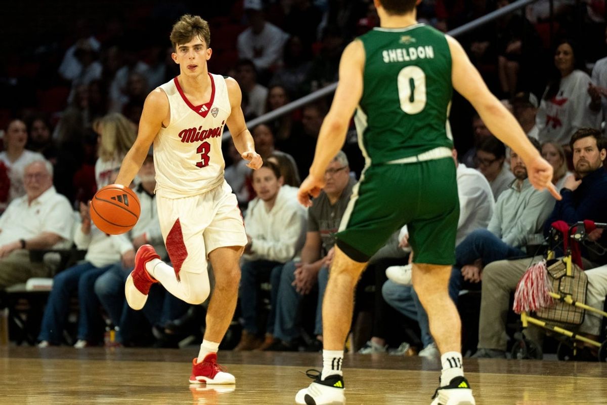 Miami RedHawks guard Luke Skaljac (3) takes the ball down court as Ohio Bobcats guard Ajay Sheldon (0) guards him in the second half of the NCAA basketball game at Millett Hall in Oxford, Ohio, on Friday, Feb. 13, 2026.