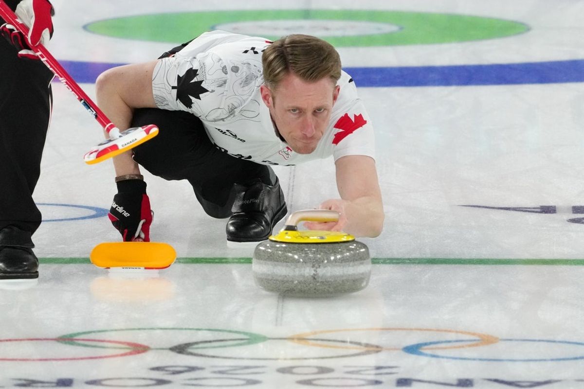 Feb 14, 2026; Cortina d'Ampezzo, Italy; Marc Kennedy of Canada during a men's curling round robin game during the Milano Cortina 2026 Olympic Winter Games at Cortina Curling Olympic Stadium. Mandatory Credit: Eric Bolte-Imagn Images