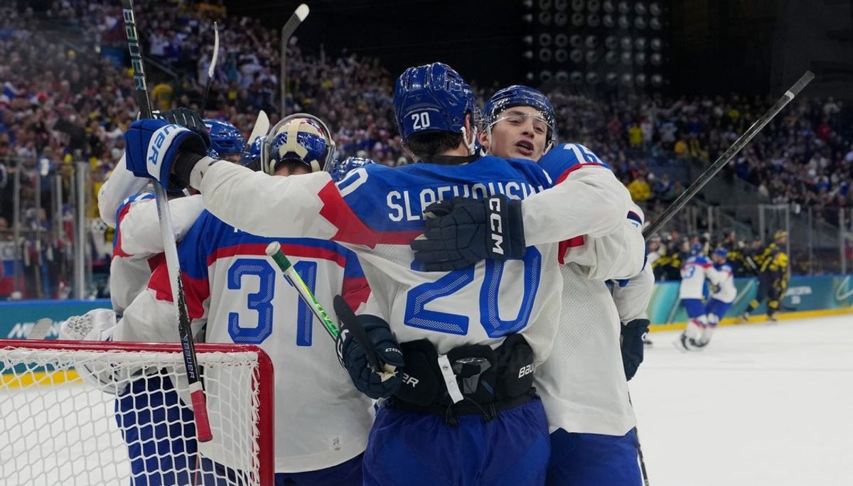 Feb 14, 2026; Milan, Italy; Slovakia players react after a Group B men's ice hockey game during the Milano Cortina 2026 Olympic Winter Games at Milano Santagiulia Ice Hockey Arena. Mandatory Credit: James Lang-Imagn Images