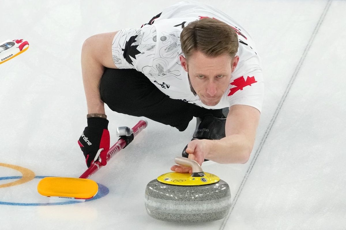 Feb 14, 2026; Cortina d'Ampezzo, Italy; Marc Kennedy of Canada during a men's curling round robin game during the Milano Cortina 2026 Olympic Winter Games at Cortina Curling Olympic Stadium. Mandatory Credit: Eric Bolte-Imagn Images