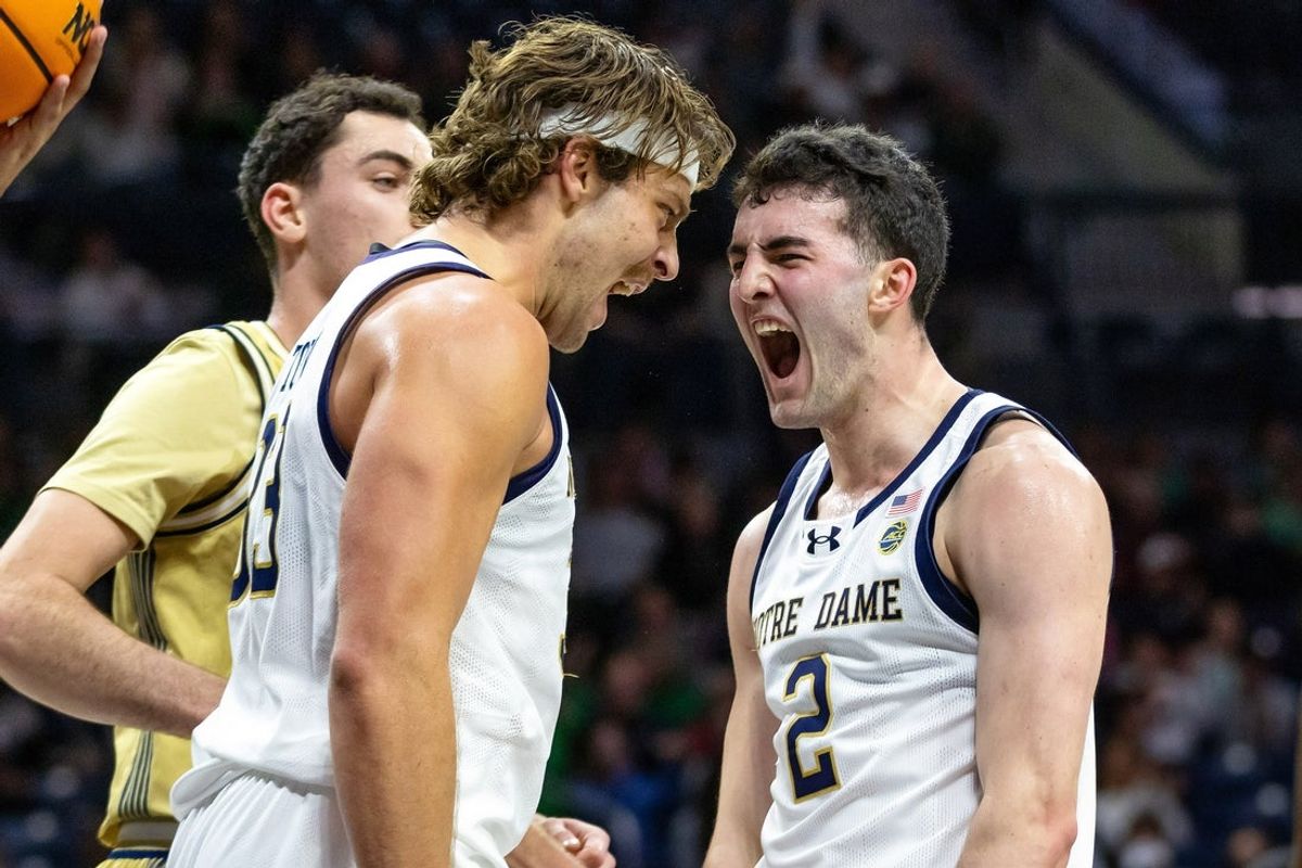Feb 14, 2026; South Bend, Indiana, USA; Notre Dame Fighting Irish forward Carson Towt (33) and guard Logan Imes (2) celebrate against the Georgia Tech Yellow Jackets during the first half at Purcell Pavilion at the Joyce Center. Mandatory Credit: Michael Caterina-Imagn Images