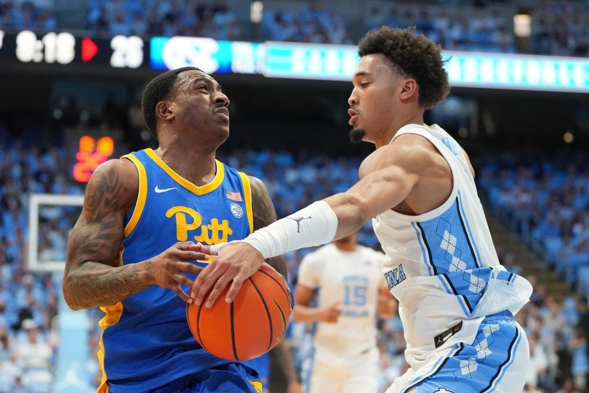 Feb 14, 2026; Chapel Hill, North Carolina, USA; North Carolina Tar Heels guard Seth Trimble (7) strips the ball from Pittsburgh Panthers guard Damarco Minor (7) in the first half at Dean E. Smith Center. Mandatory Credit: Bob Donnan-Imagn Images