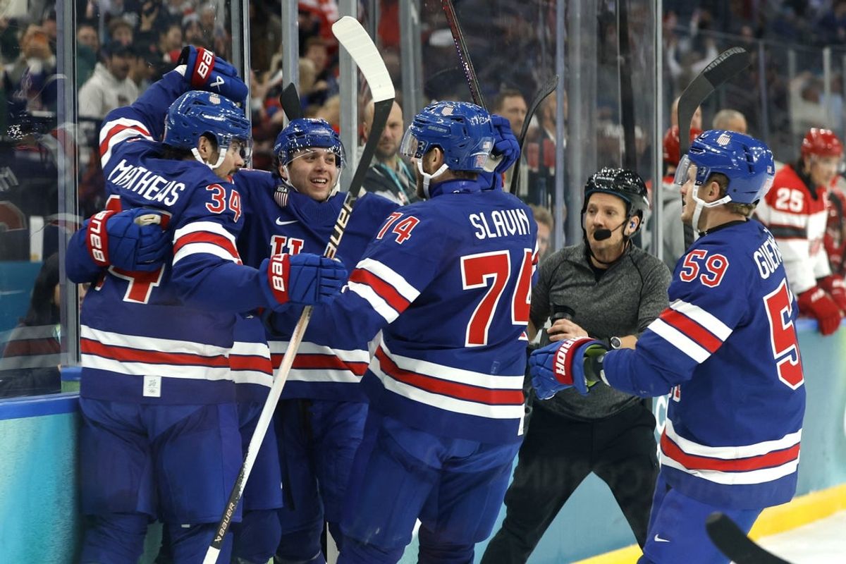 Feb 14, 2026; Milan, Italy; Matt Boldy of United States celebrates scoring their first goal with teammates against Denmark in men's ice hockey group C play during the Milano Cortina 2026 Olympic Winter Games at Milano Santagiulia Ice Hockey Arena. Mandatory Credit: Geoff Burke-Imagn Images