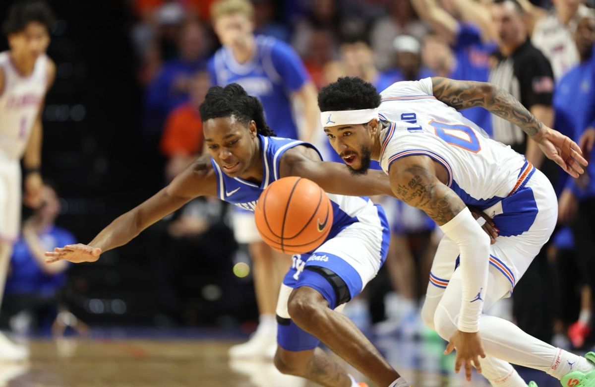 Florida guard Boogie Fland (0) steals the ball from Kentucky guard Jasper Johnson (2) during the first half of a NCAA mens basketball game at Steven C. O'Connell Center Exactek arena in Gainesville, FL on Saturday, February 14, 2026. [Alan Youngblood/Gainesville Sun]