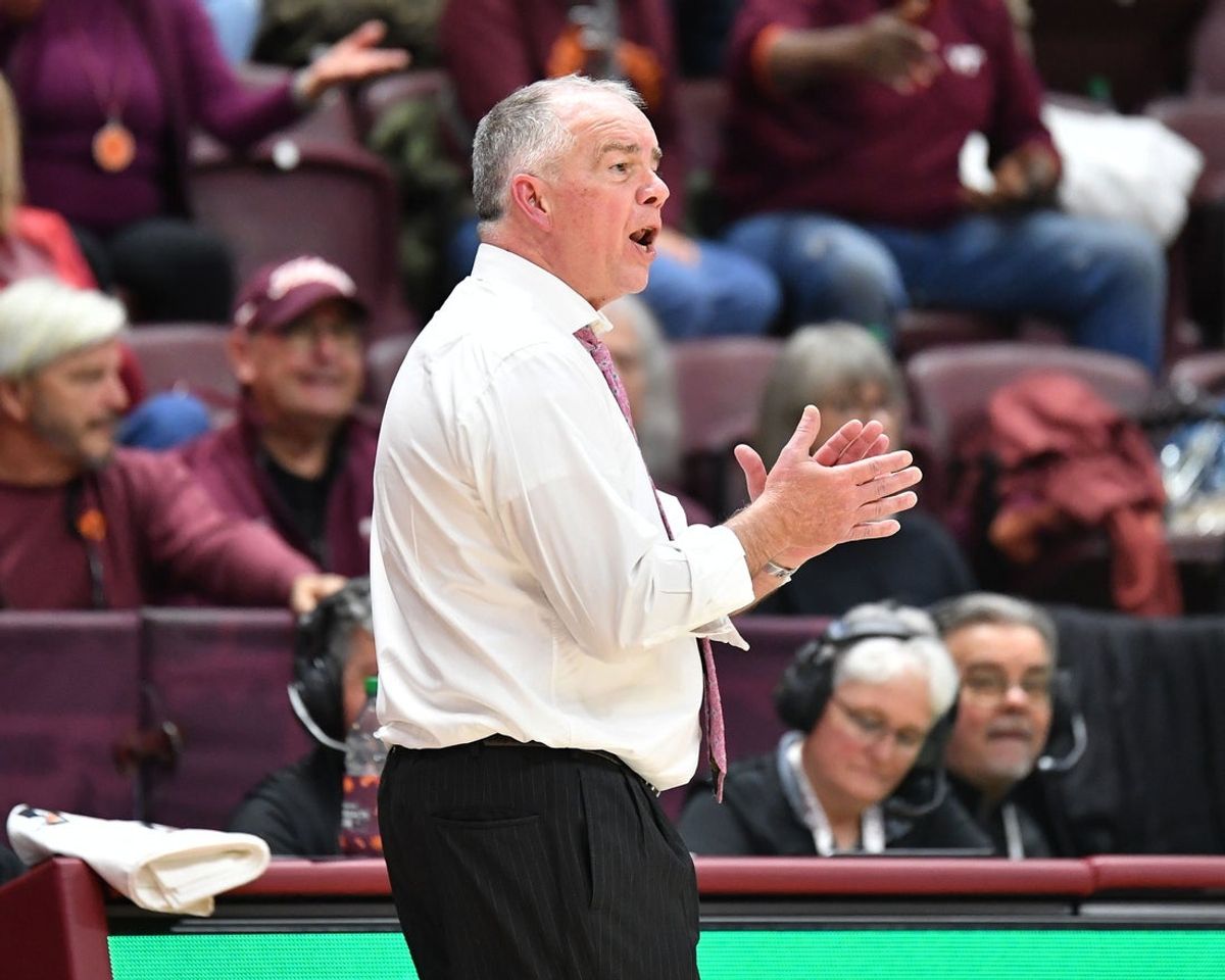 Feb 14, 2026; Blacksburg, Virginia, USA;  Virginia Tech Hokies head coach Mike Young cheers for his team during the second half at Coliseum. Mandatory Credit: Brian Bishop-Imagn Images