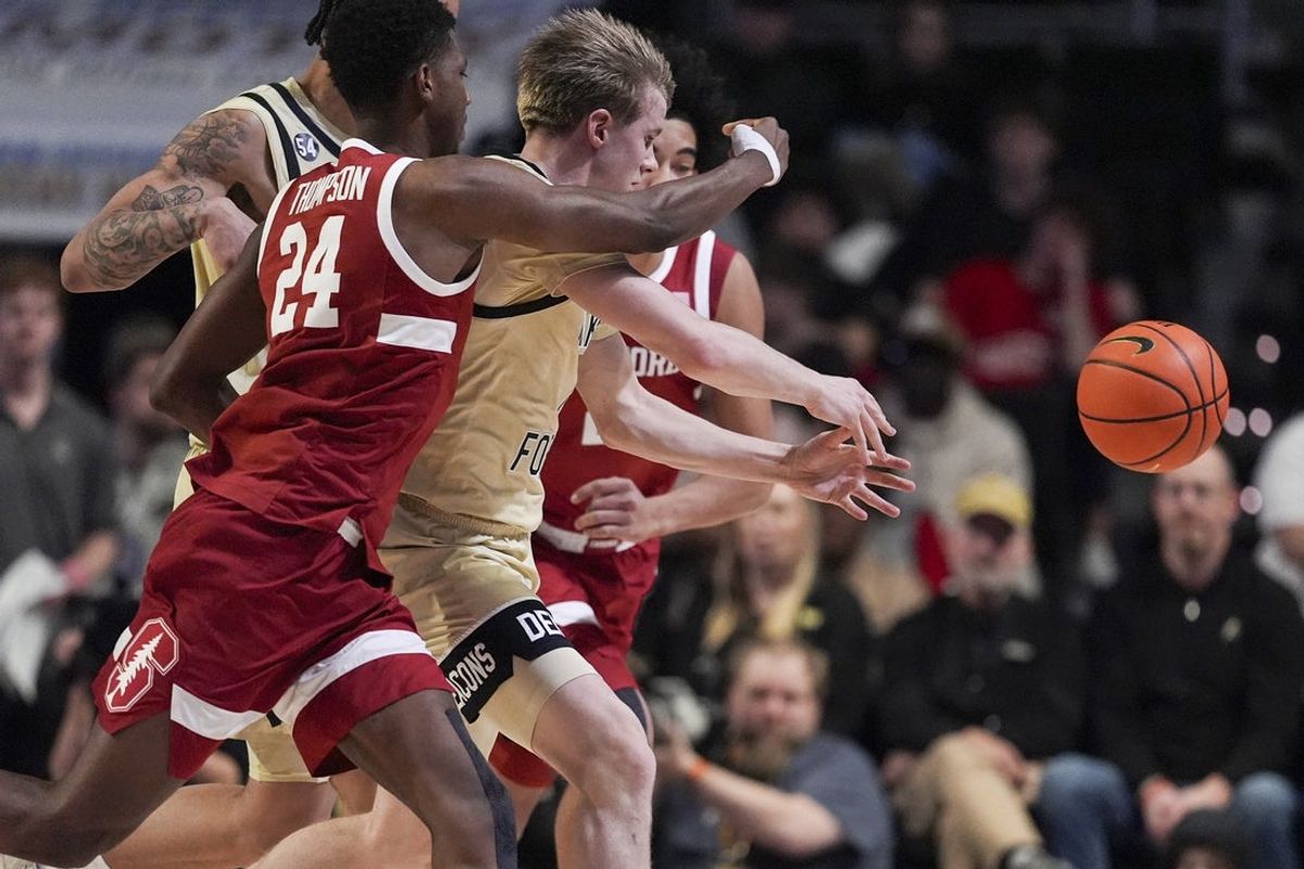 Feb 14, 2026; Winston-Salem, North Carolina, USA; Stanford Cardinal and Wake Forest Demon Deacons players scramble for the loose ball  during the first half at Lawrence Joel Veterans Memorial Coliseum. Mandatory Credit: Jim Dedmon-Imagn Images