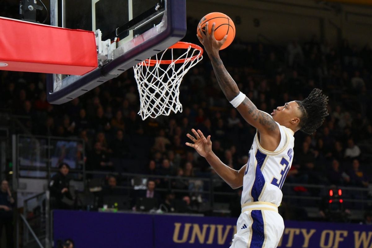 Feb 14, 2026; Seattle, Washington, USA; Washington Huskies guard Courtland Muldrew (30) shoots the ball against the Minnesota Golden Gophers during the first half at Alaska Airlines Arena at Hec Edmundson Pavilion. Mandatory Credit: Steven Bisig-Imagn Images