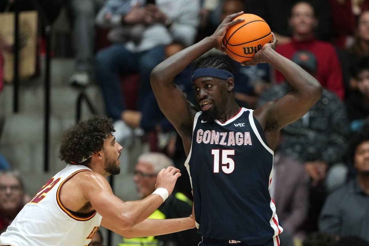 Feb 14, 2026; Santa Clara, California, USA; Gonzaga Bulldogs forward Graham Ike (15) handles the ball against Santa Clara Broncos forward Allen Graves (22) during the first half at Leavey Center. Mandatory Credit: Darren Yamashita-Imagn Images