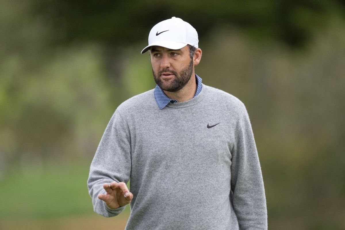 February 15, 2026; Pebble Beach, California, USA; Scottie Scheffler acknowledges the crowd on the second hole during the final round of the AT&T Pebble Beach Pro-Am golf tournament at Pebble Beach Golf Links. Mandatory Credit: Kyle Terada-Imagn Images