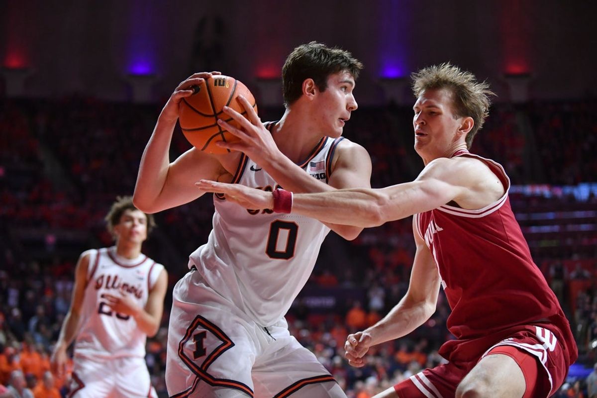 Feb 15, 2026; Champaign, Illinois, USA;  Illinois Fighting Illini forward David Mirkovic (0) looks to pass as Indiana Hoosiers forward Reed Bailey (1) defends during the second half at State Farm Center. Mandatory Credit: Ron Johnson-Imagn Images